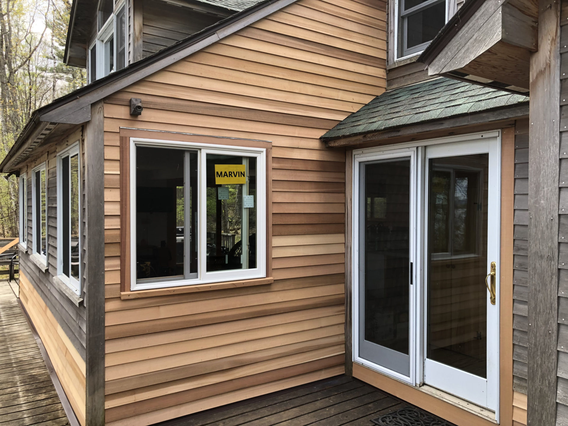 New Cedar Siding and New Windows by XL Home Improvements.