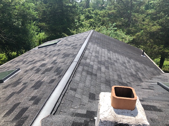 XL Home Improvements did a complete gambrel roof replacement in Skippack, PA, including five new skylights and custom copper chimney flashing.