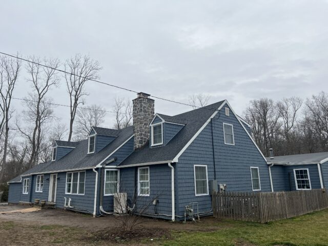 Job complete with new gutters and upper siding section complete