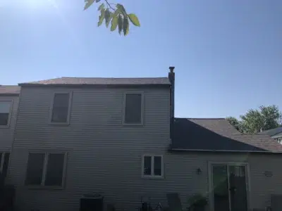 Backside view of a home in Harleysville, PA after a completed shingle roof replacement.