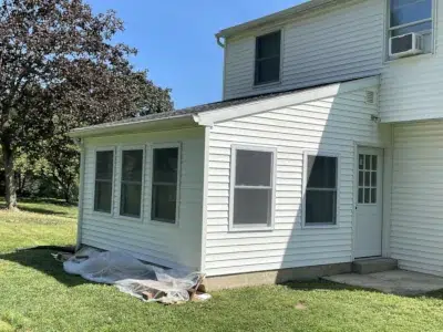 Completed siding installation on a new addition at a residential property in Downingtown, PA, with the siding fully installed and flush with the existing structure for a seamless, cohesive exterior.