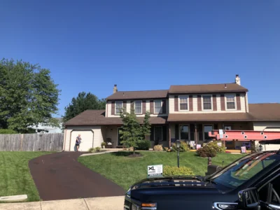 Full view of the front exterior of a Harleysville, PA home showcasing a newly installed shingle roof with IKO Cambridge Architectural Shingles in Dual Brown, highlighting the rich color and dimensional texture.