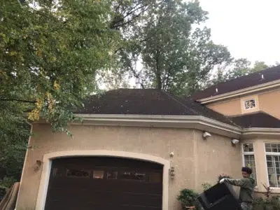 Old weathered roof above garage before replacement by XL Home Improvements.