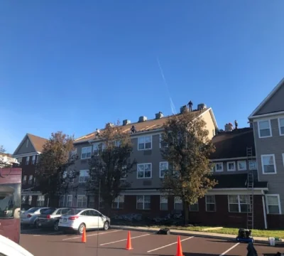 Commercial apartment building shingle roof replacement at Park View at Oak Crest in Harleysville, PA by XL Home Improvements.