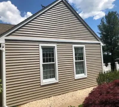 Siding and gutter repair on a residential home in Harleysville, PA by XL Home Improvements.