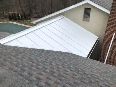 White Standing Seam Metal Roof & GAF Timberline Williamsburg Slate Shingles – Collegeville, PA | XL Home Improvements New white standing seam metal roof and GAF Timberline Williamsburg Slate shingle installation on a residential home in Collegeville, PA by XL Home Improvements.