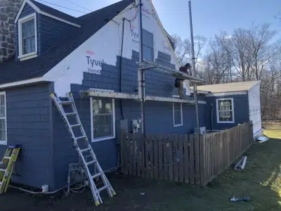 XL Home Improvements installing new siding over Tyvek House Wrap on the side of a home in Berwyn, PA.