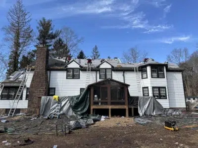 Schwenksville roof with new underlayment installed and shingles being added after decking replacement by XL Home Improvements.