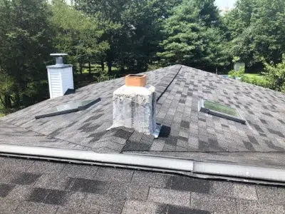 Roof with skylights and chimney before roof replacement in Harleysville PA