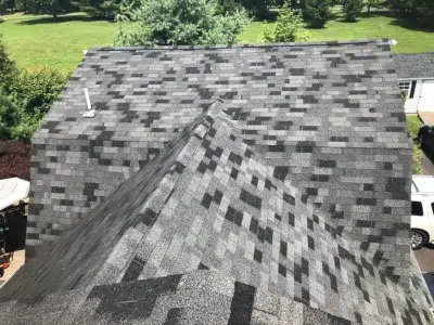 Old shingles on gambrel roof before roof replacement in Harleysville PA