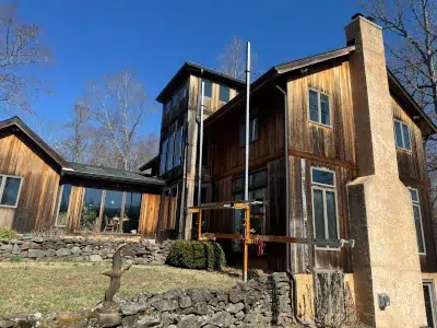 Aged and weathered cedar siding on a residential home in Green Lane, PA before siding replacement by XL Home Improvements