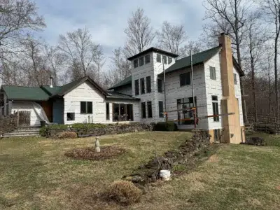 Housewrap installed over wood sheathing during siding replacement project in Green Lane, PA by XL Home Improvements