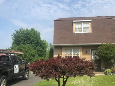 Roof before replacement in Lansdale PA showing worn shingles on twin home
