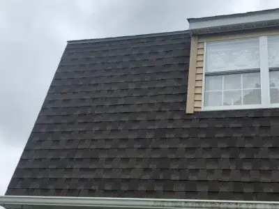 Roof installation in progress in Lansdale, PA with XL Home Improvements crew installing new shingles on a twin home.