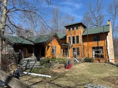 Siding removed and wood sheathing exposed during siding replacement project in Green Lane, PA by XL Home Improvements